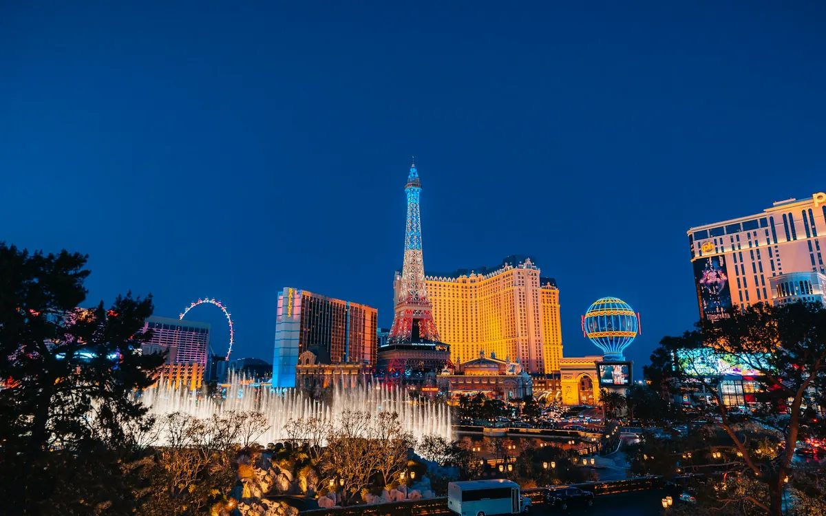 Las Vegas Strip hotels and fountains under a deep blue evening sky