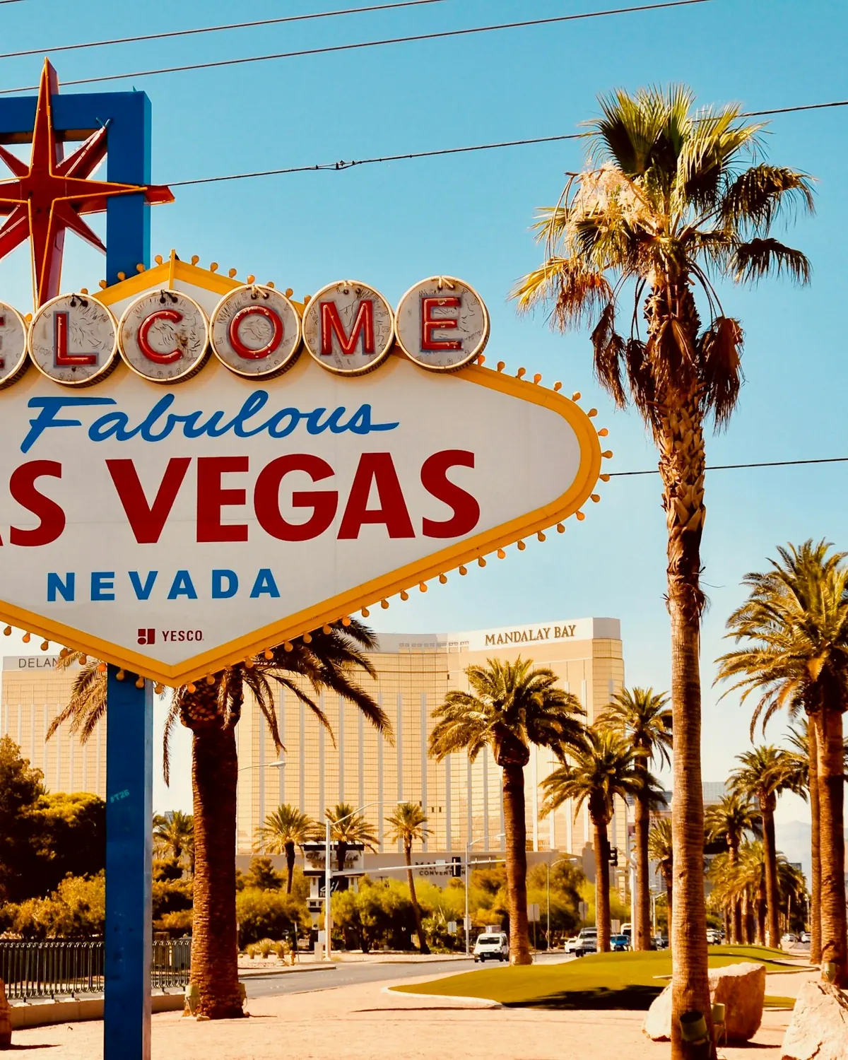 The Welcome to Fabulous Las Vegas sign under a bright desert sky